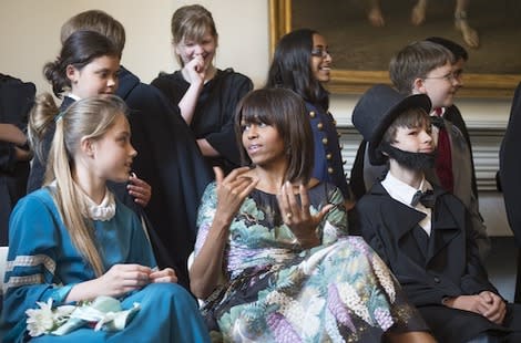 Michelle Obama speaks with elementary students at the Decatur House