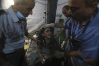 FILE - Medics treat a wounded girl at the al Najar hospital following an Israeli airstrike on their family building in Rafah, southern Gaza Strip, Saturday, Aug. 6, 2022. (AP Photo/Hatem Ali, File)