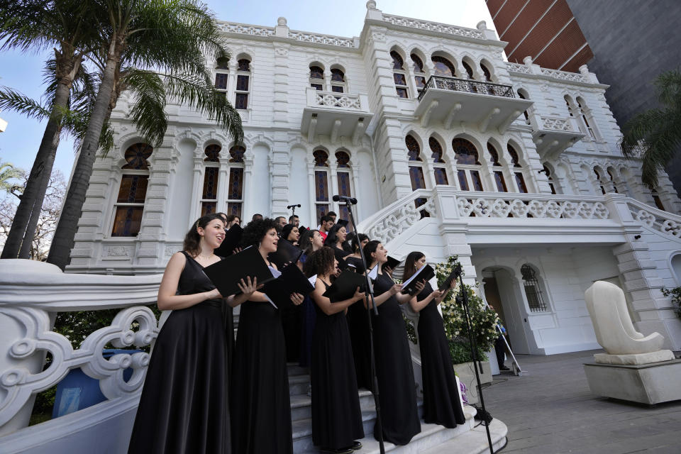 A choir performs during the reopening event in the courtyard of the Sursock Museum during an opening event for the iconic venue in Beirut, Lebanon, Friday, May 26, 2023. The museum has reopened to the public, three years after after a deadly explosion in the nearby Beirut port reduced many of its treasured paintings and collections to ashes. (AP Photo/Hussein Malla)