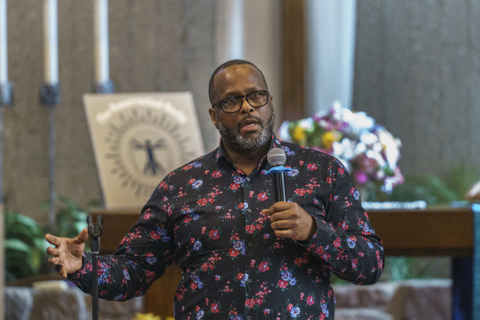 Robert D. Jiles, assistant professor of American Studies at California State University, Chico, addresses survivors and descendants of Palm Springs Section 14 residents gathered at the United Methodist Church in Palm Springs, Calif., Sunday, April 16, 2023. Black and Latino Californians who were displaced from their Section 14 neighborhood in Palm Springs allege the city pushed them out by hiring contractors to destroy homes in an area that was tight-knit and full of diversity. (AP Photo/Damian Dovarganes)