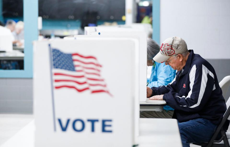 Thomas Heslin casts his ballot at the Oak Grove Community Center polling location on Tuesday, April 2, 2024.