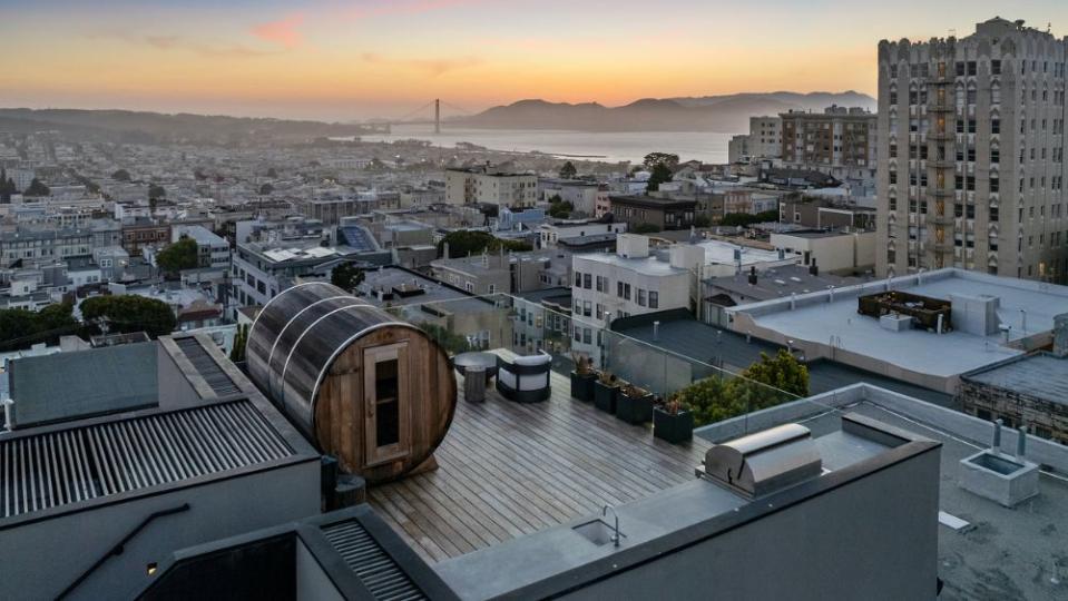 On the roof deck is a custom, wooden barrel sauna. - Credit: Open Homes Photography