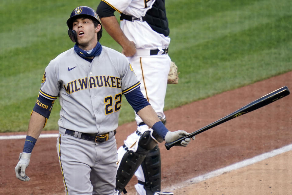 Milwaukee Brewers' Christian Yelich (22) reacts after striking out against the Pittsburgh Pirates in the fifth inning of a baseball game, Saturday, Aug. 22, 2020, in Pittsburgh. (AP Photo/Keith Srakocic)