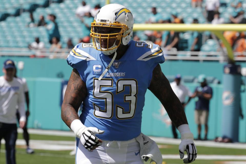 Mike Pouncey warms up before a game.