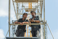 <p>Andrew Lincoln and his stunt double Felipe Savahge peruse cell phone pics while hanging around a ferris wheel in “Say Yes.”<br><br>(Photo: AMC) </p>