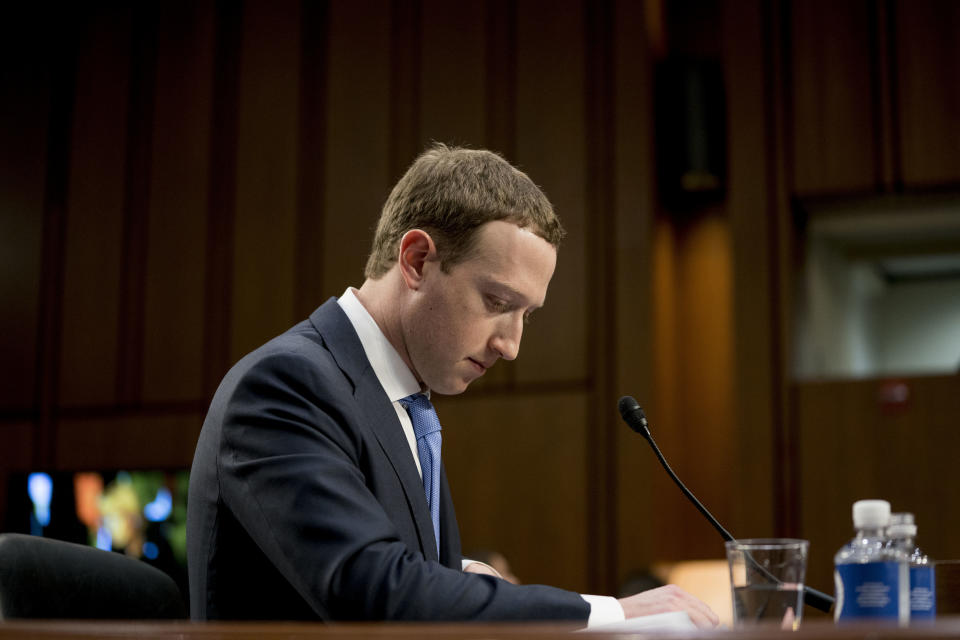Facebook CEO Mark Zuckerberg pauses while testifying before a joint hearing of the Commerce and Judiciary Committees on Capitol Hill in Washington about the use of Facebook data to target American voters in the 2016 election. Facebook shares tumbling on Thursday after the company reported a poor second quarter Wednesday afternoon. (AP Photo/Andrew Harnik)