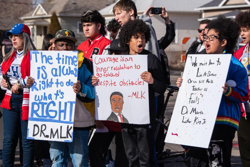 Savion Bates, Judah Skinner and Addison Galbreath, students at Blevins Middle School, take part in the annual Martin Luther King Jr. Day march along South Meldrum Street on Monday, Jan. 16, 2023, in Fort Collins, Colo.
