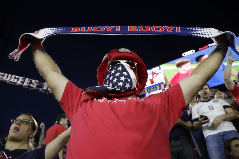 A U.S. supporter cheers prior to a CONCACAF Nations League soccer match between the United States and Cuba on Friday, Oct. 11, 2019, in Washington. (AP Photo/Julio Cortez)