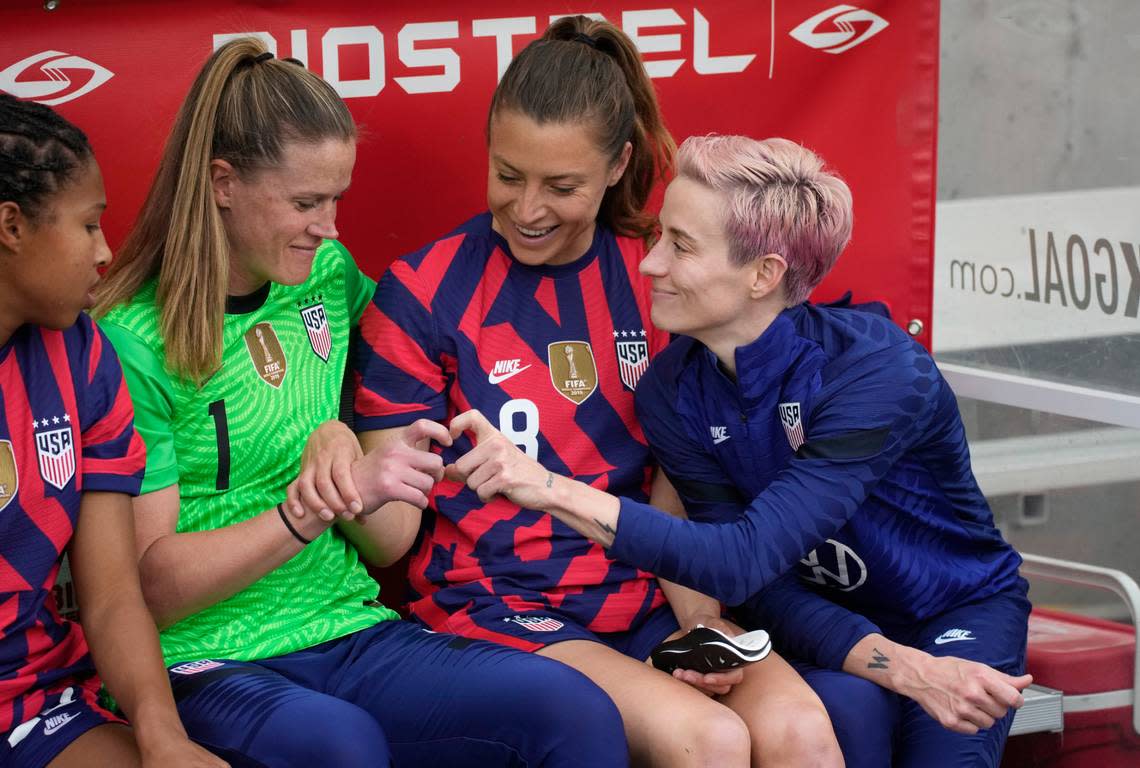 Sofia Huerta, center, helps U.S. goalkeeper Alyssa Naeher, left, and Megan Rapinoe form a heart before the first of two friendlies against Colombia on June 25.