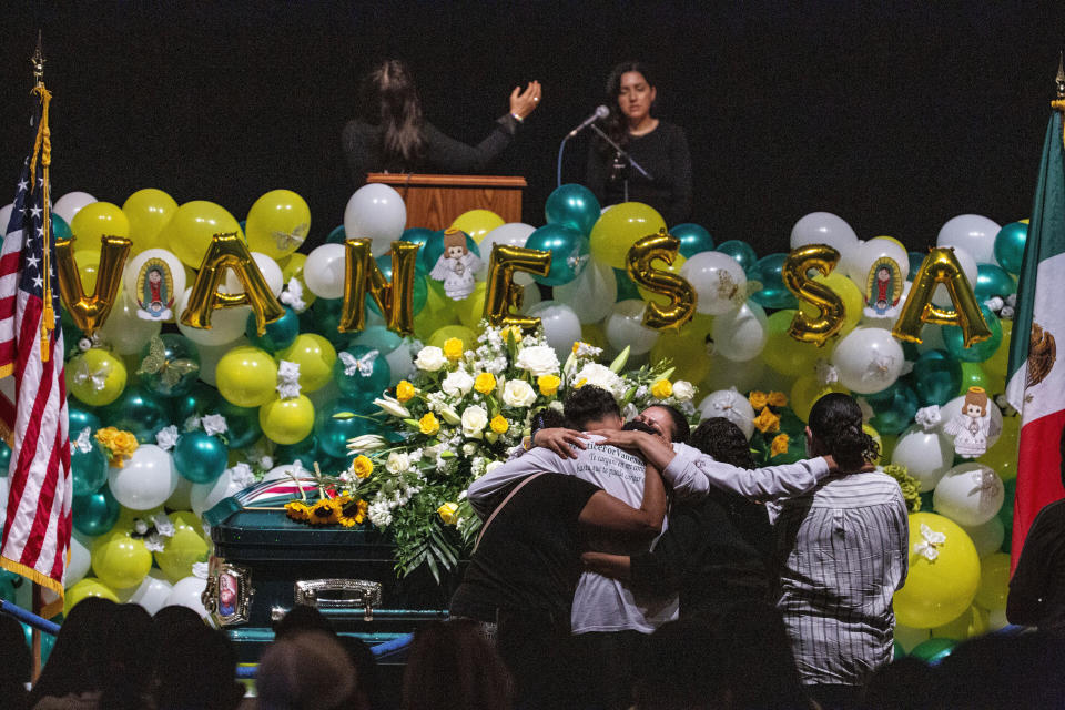 Alma Garcia embraces Juan Cruz, the boyfriend of Army Spc. Vanessa Guillen at her memorial service on Friday, Aug. 14, 2020, in Houston. Guillen, who was last seen on April 22, was laid to rest nearly four months after she is said to have been killed by a fellow soldier at Fort Hood, a U.S. Army base in Texas. Mourners gathered at Cesar Chavez High School where Guillen grew up playing soccer and dreaming of joining the military. (Marie D. De Jesus/Houston Chronicle via AP, Pool)