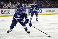 FILE - In this June 25, 2021, file photo, Tampa Bay Lightning right wing Nikita Kucherov (86) moves the puck against the New York Islanders during the second period in Game 7 of an NHL hockey Stanley Cup semifinal playoff series in Tampa, Fla. (AP Photo/Chris O'Meara, File)