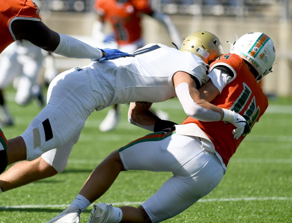 Hoban's Tanner Mintz sacks Frederick Douglass quarterback Jaxon Strautman on Aug. 19 in Canton.