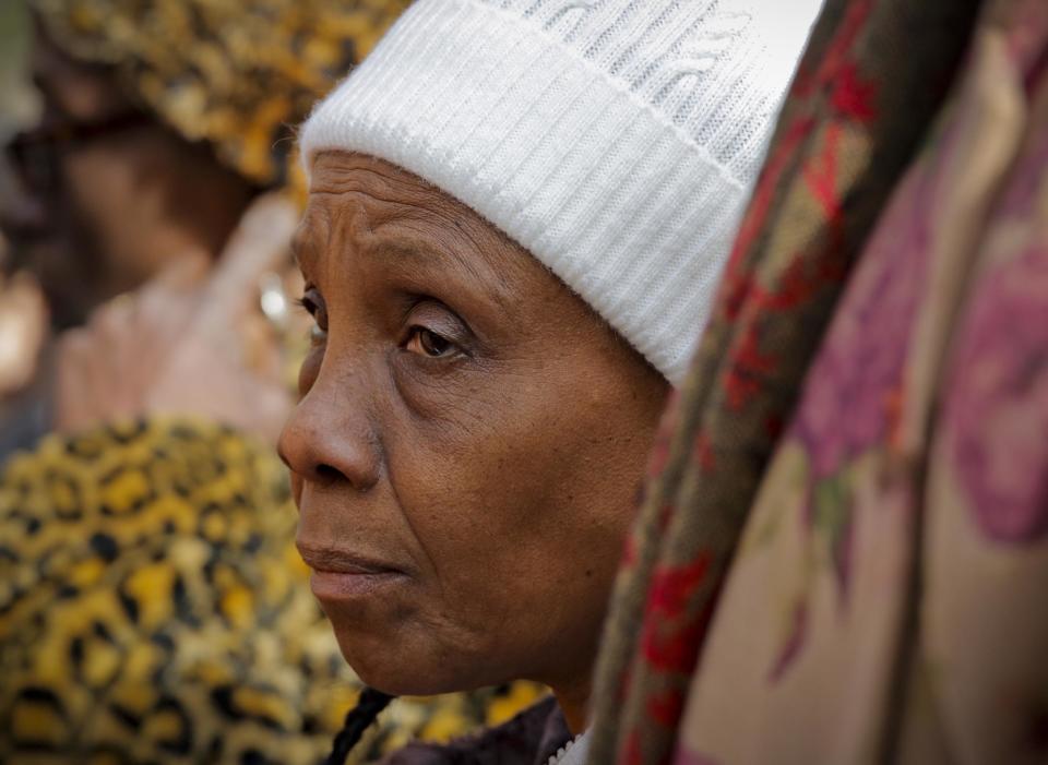 Patricia Hartley, grandmother of shooting victim Ramarley Graham, listens during a press conference outside police headquarters, Thursday Jan. 19, 2017, in New York. A disciplinary trial is underway for NYPD officer Richard Haste, who shot and killed the unarmed 18-year-old Graham in the bathroom of his New York City apartment with Hartley present. (AP Photo/Bebeto Matthews)