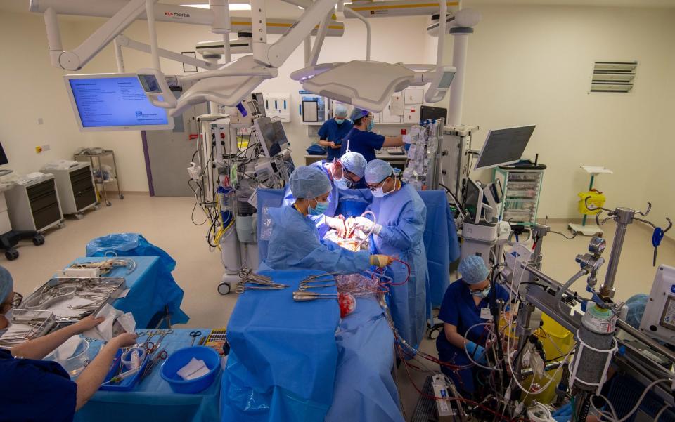 Surgical teams in theatre at the Royal Papworth Hospital, Cambridge - Joe Giddens/PA