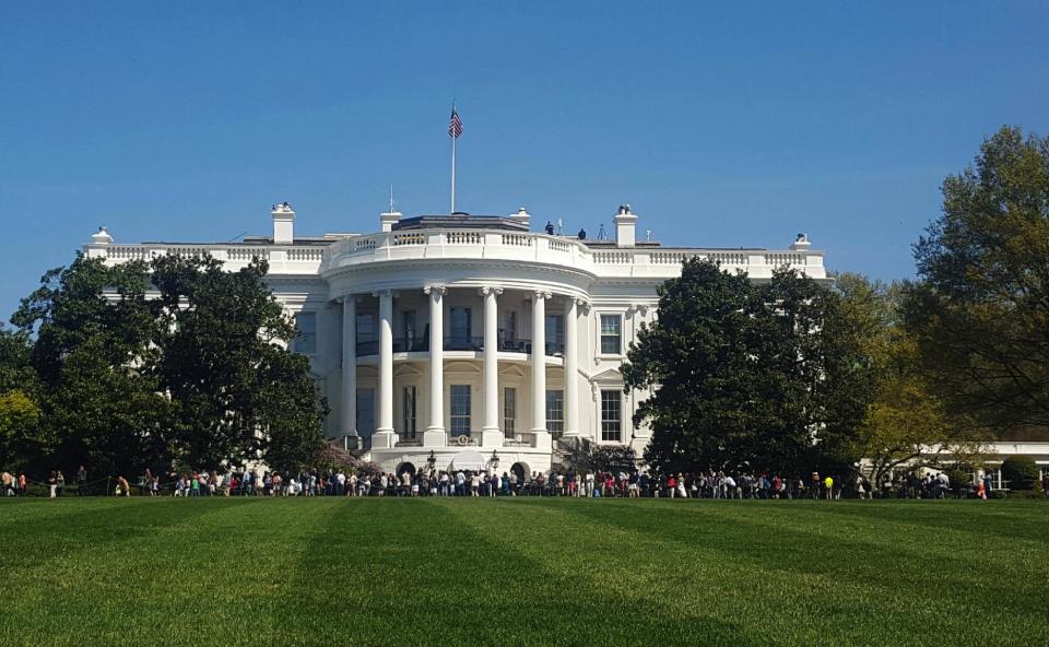 FILE - In this April 17, 2016 file photo, people visit the south lawn during the annual White House Spring Garden tours in Washington. The U.S. Secret Service says a person is under arrest after climbing a fence and getting onto the south grounds of the White House. The breach happened at about 11:38 p.m. Friday, March 10, 2017. President Donald Trump was at the White House. (AP Photo/Estelle Doro)