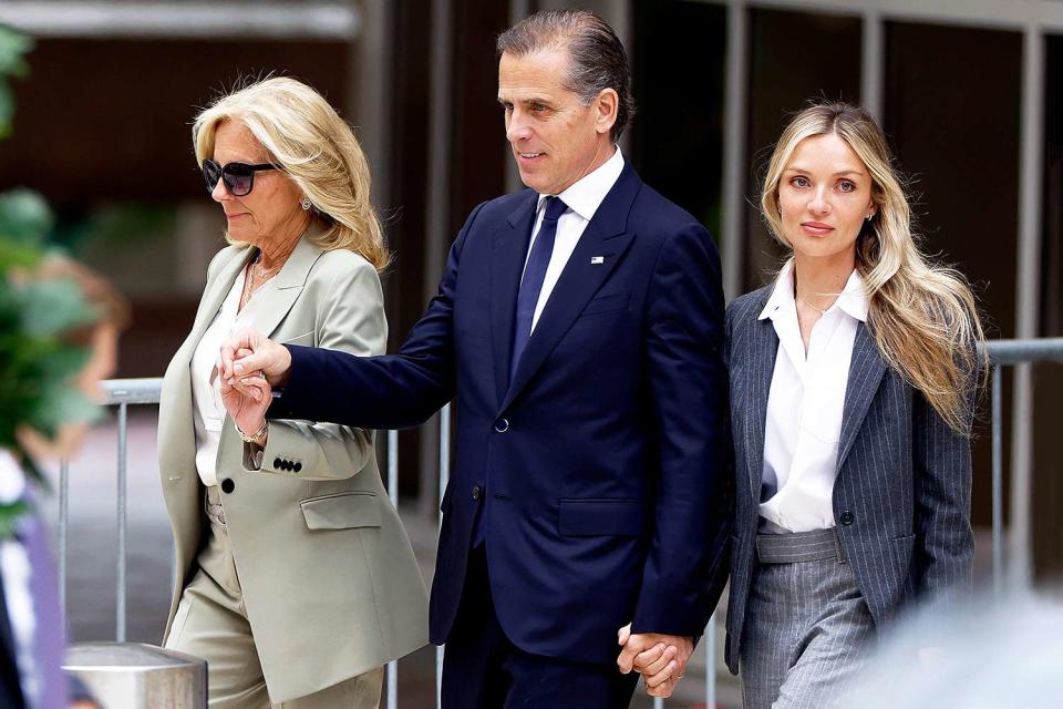 <p>Anna Moneymaker/Getty</p> First lady Jill Biden, Hunter Biden, and Melissa Cohen Biden hold hands leaving the federal courthouse on June 11, 2024