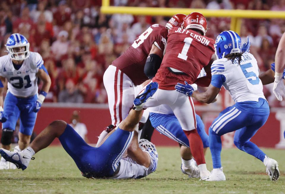 Brigham Young Cougars hurry Arkansas Razorbacks quarterback KJ Jefferson (1) at Razorback Stadium in Fayetteville on Saturday, Sept. 16, 2023. | Jeffrey D. Allred, Deseret News