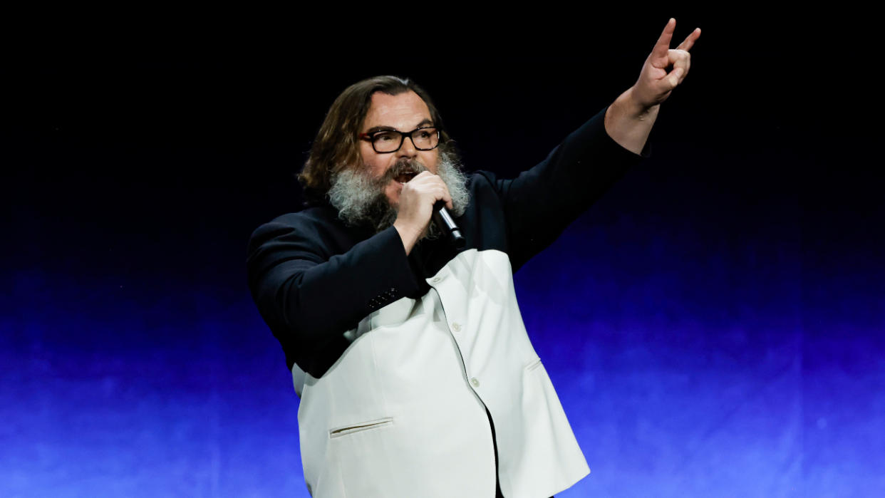  Jack Black making the devil horns hand gesture onstage in 2023. 