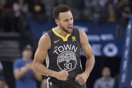 December 30, 2017; Oakland, CA, USA; Golden State Warriors guard Stephen Curry (30) celebrates after making a three-point basket against the Memphis Grizzlies during the second quarter at Oracle Arena. Mandatory Credit: Kyle Terada-USA TODAY Sports