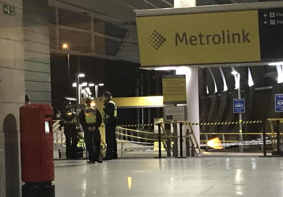 Police at Victoria Station in Manchester on New Year’s Even after a man stabbed three people (Picture: PA)