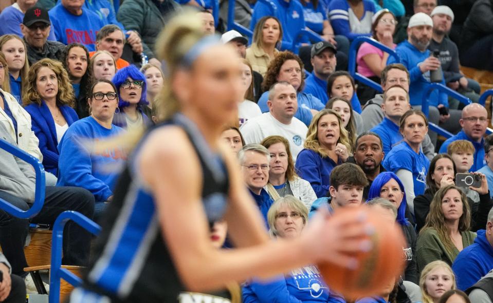 Hamilton Southeastern Royals fans watch Hamilton Southeastern Royals Maya Makalusky (3) prepare to shoot a three-point basket Saturday, Feb. 3, 2024, during the IHSAA girls basketball sectional Class 4A game at Hamilton Southeastern High School in Indianapolis. The Noblesville Millers defeated the Hamilton Southeastern Royals, 49-45.