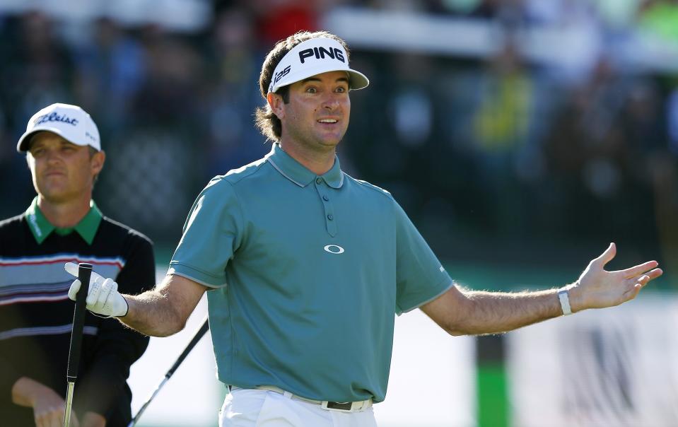 Bubba Watson urges the crowd to cheer after his tee shot at the 16th hole during the third round of the Phoenix Open golf tournament Saturday, Feb. 1, 2014, in Scottsdale, Ariz. (AP Photo/Ross D. Franklin)