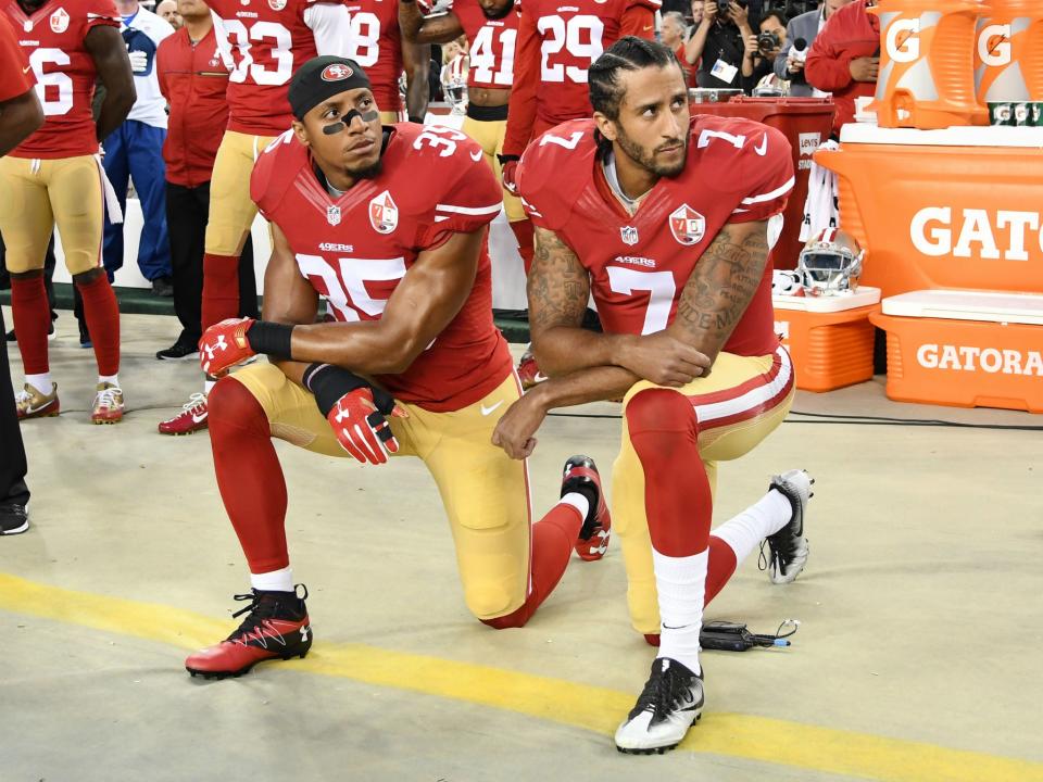 Colin Kaepernick (right) and Eric Reid (left) during their time with the San Francisco 49ersGetty Images