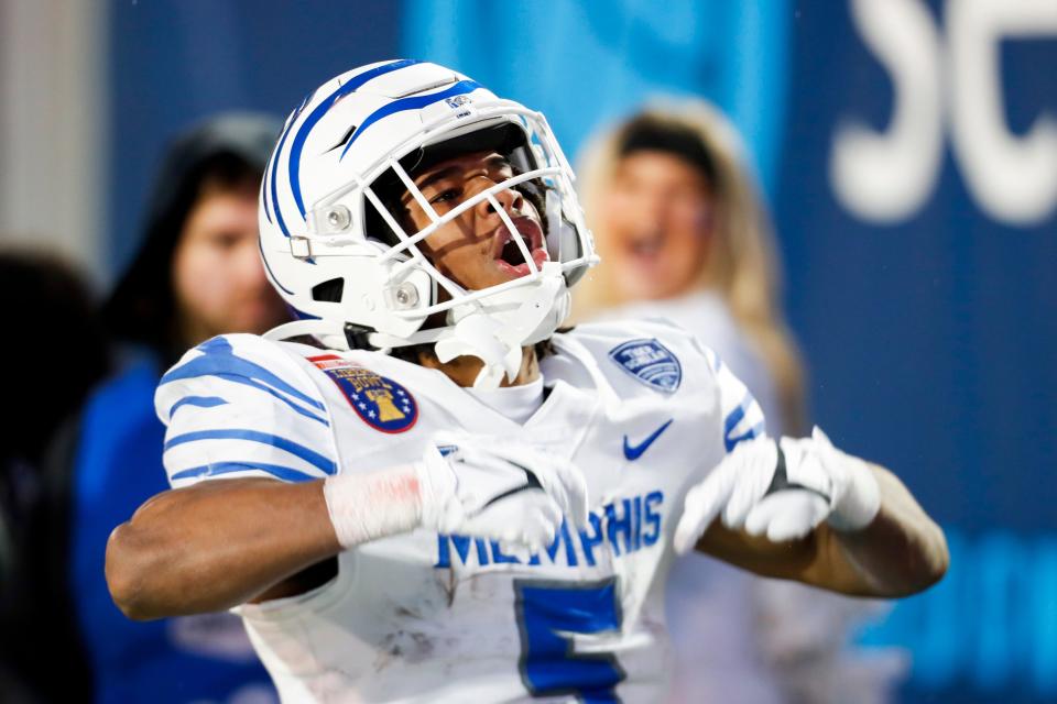 Memphis' Sutton Smith (5) celebrates after scoring a touchdown during the game between the University of Memphis and Iowa State University in the AutoZone Liberty Bowl at Simmons Bank Liberty Stadium on Dec. 29, 2023.