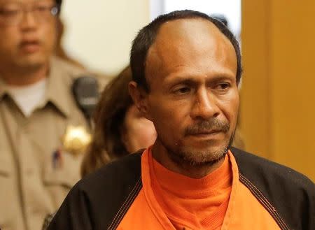 FILE PHOTO: Jose Ines Garcia Zarate, arrested in connection with the July 1, 2015, shooting of Kate Steinle on a pier in San Francisco is led into the Hall of Justice for his arraignment in San Francisco, California, U.S. on July 7, 2015. REUTERS/Michael Macor/Pool/File Photo