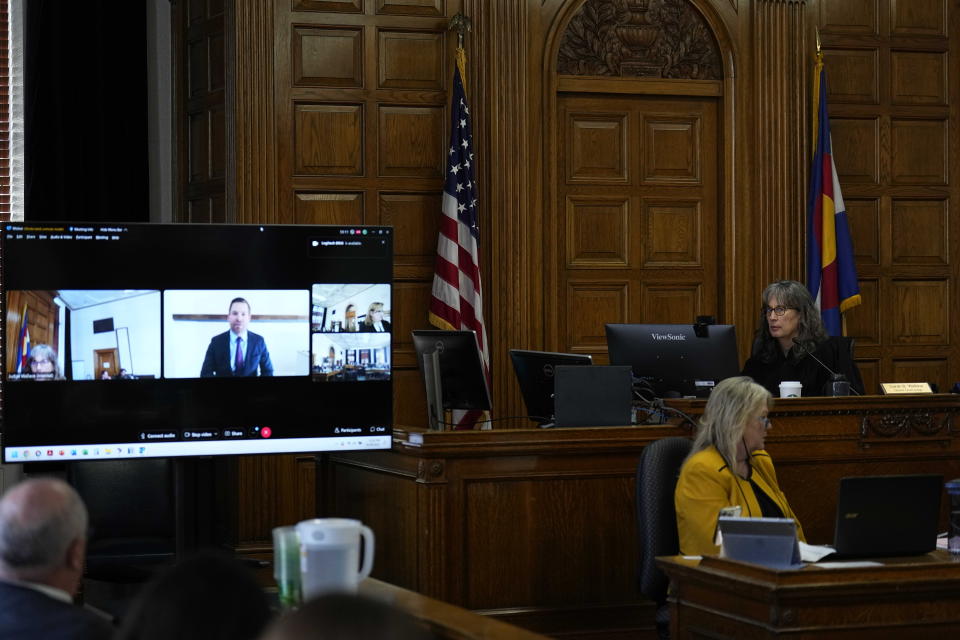 U.S. Rep Eric Swalwell, D-Calif, remotely testifies as Judge Sarah B. Wallace presides over a hearing for a lawsuit to keep former President Donald Trump off the state ballot in court Monday, Oct. 30, 2023, in Denver. (AP Photo/Jack Dempsey)