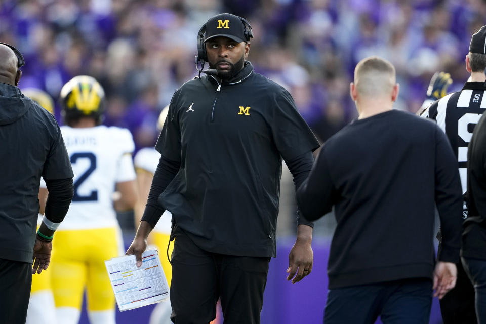 Michigan head coach Sherrone Moore walks on the sideline during the first half of an NCAA college football game against Washington, Saturday, Oct. 5, 2024, in Seattle. (AP Photo/Lindsey Wasson)