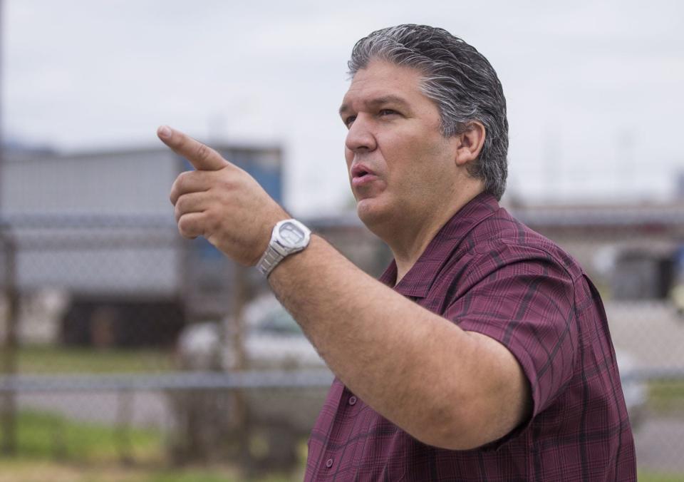 Victor Cao, owner of Fun F/X, at the site of a fire that wiped out his South Bend warehouse in July 2019. Tribune File Photo/Robert Franklin