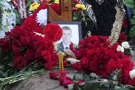 A view shows the grave of Russian serviceman Fyodor Zhuravlyov after the funeral at a cemetery in the village of Paltso, Bryansk region, Russia, November 24, 2015. REUTERS/Maria Tsvetkova