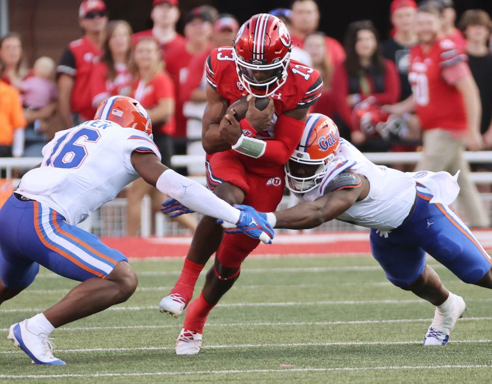 Utah Utes quarterback Nate Johnson runs against the Florida Gators in Salt Lake City on Thursday, Aug. 31, 2023, during the season opener. If Rising is unable to go against Weber State Saturday, Johnson will get the nod at QB. | Jeffrey D. Allred, Deseret News