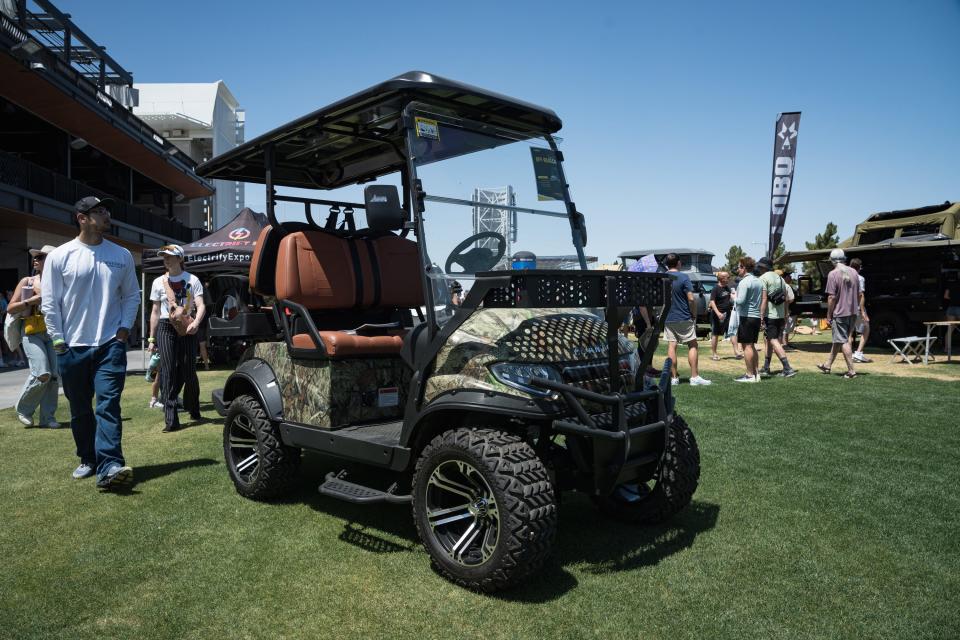 The Phantom Off-Road Cart sits on display at the Electrify Expo outside State Farm Stadium on May 4, 2024 in Glendale, Ariz. The electric vehicle includes a solar charging rooftop.