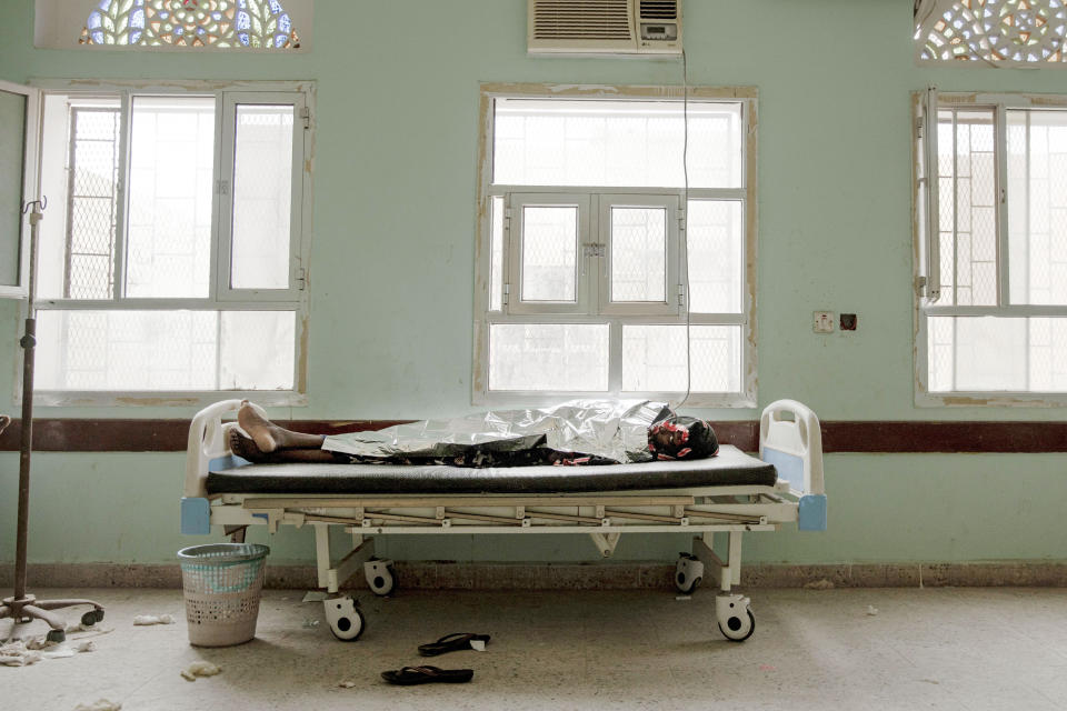 In this July 26, 2019 photo, 22-year-old Dasto Mohammed, a migrant from Ethiopia, lays on a gurney after disembarking from a boat and feeling sick from the sea, at the Ras al-Ara Hospital, Lahj, Yemen. Mohammed left home in Harar, Ethiopia with her younger sister Fadya. The girls spent an entire month traveling before they reached Yemen's Ras al-Ara .(AP Photo/Nariman El-Mofty)