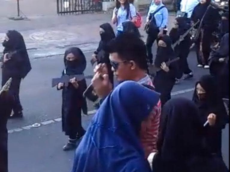 Kindergarten apologises after children dressed in Isis-style costumes for Indonesia parade