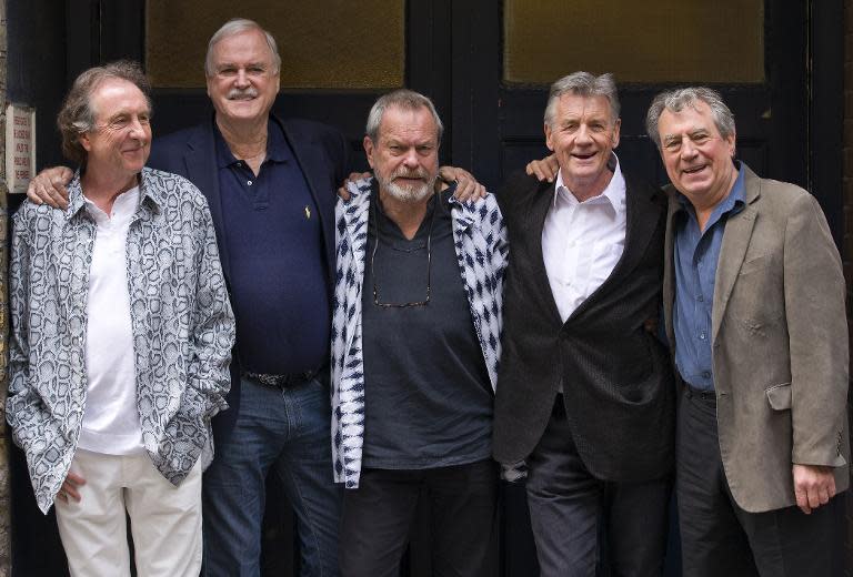 British comedy troupe Monty Python, (L-R) Eric Idle, John Cleese, Terry Gilliam, Michael Palin, and Terry Jones pose for a photograph at the back door to the London Palladium in central London on June 30, 2014