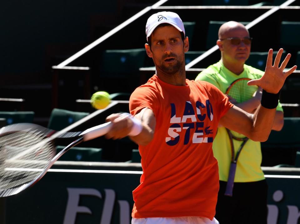 Djokovic watched on by his new coach, Andre Agassi (Getty)