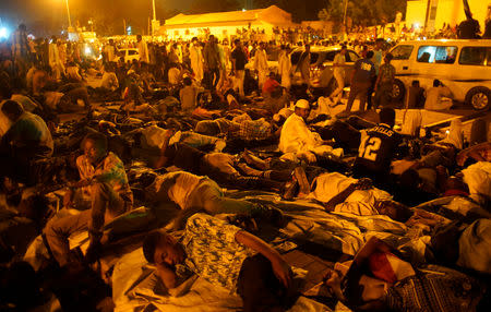 Sudanese demonstrators sleep after the Defence Minister Awad Ibn Auf stepped down as head of the country's transitional ruling military council, as protesters demanded quicker political change, outside the Defence Ministry in Khartoum, Sudan April 13, 2019. REUTERS/Stringer