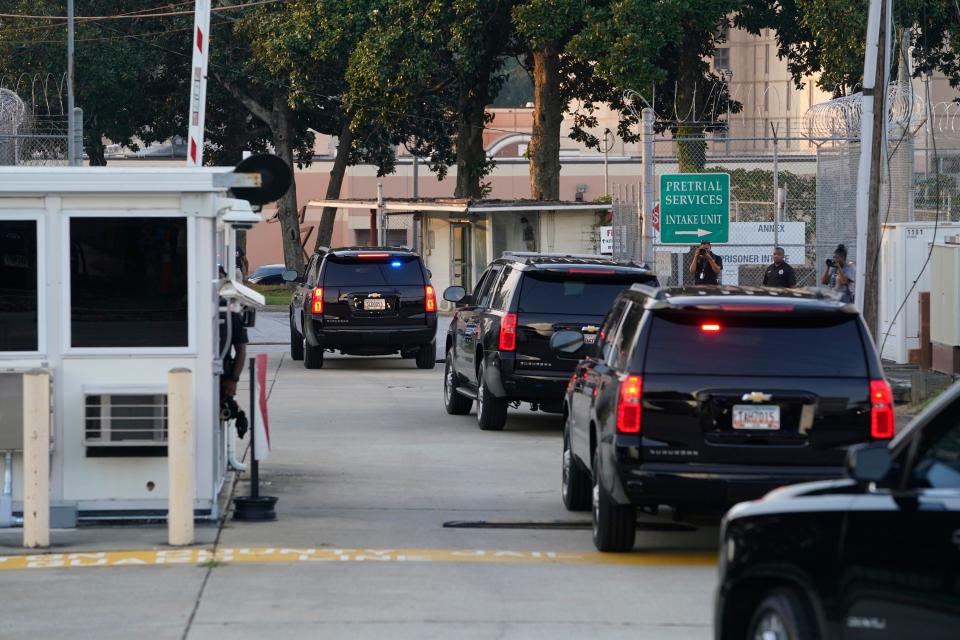 Former president Trump arrives at Fulton County Jail intake center in Atlanta, GA. A grand jury in Fulton County, Georgia indicted former president Donald Trump and 18 other defendants with 41 charges related to tampering with the 2020 election.