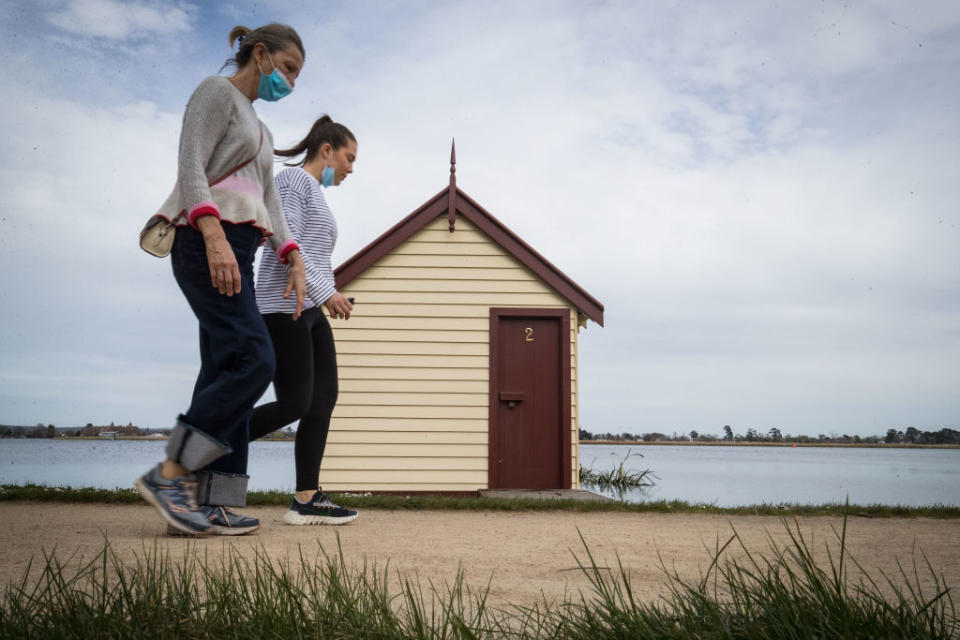 People walk around Lake Wendouree in Ballarat, Australia. 