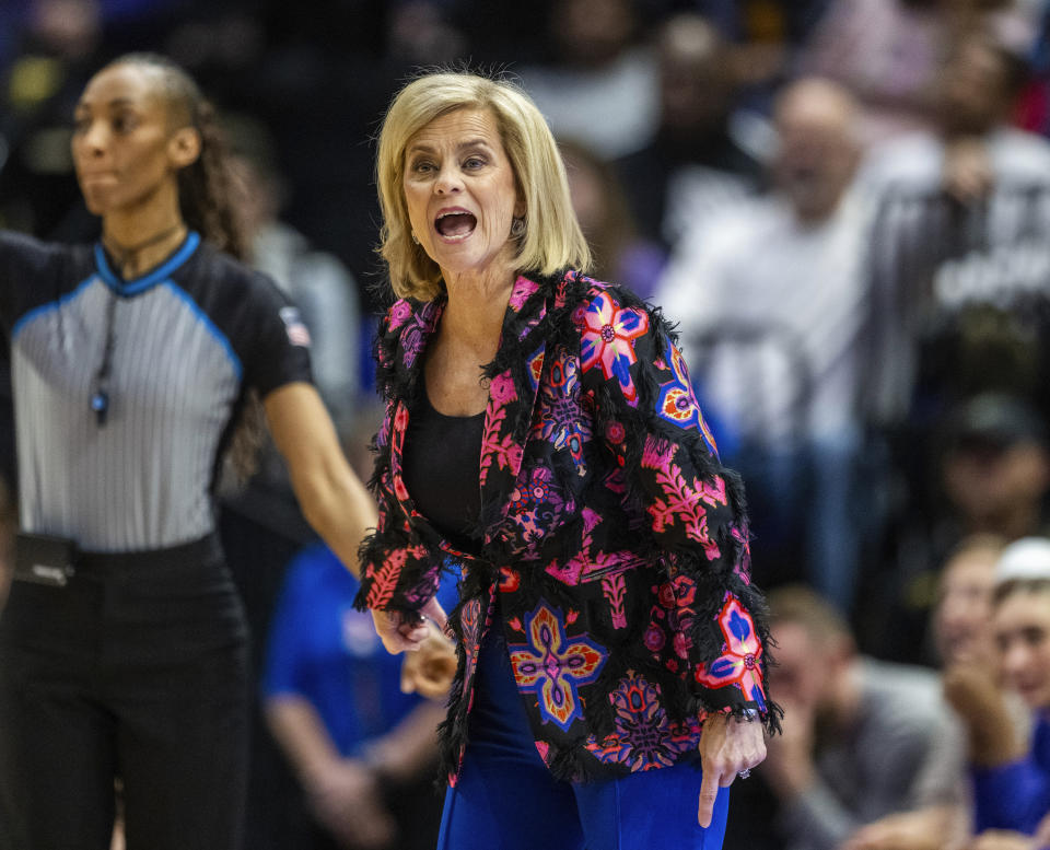 LSU head coach Kim Mulkey, center, yells for a call against Arkansas in the first period of an NCAA college basketball game Sunday, Jan. 21, 2024, in Baton Rouge, La. (Michael Johnson/The Advocate via AP)