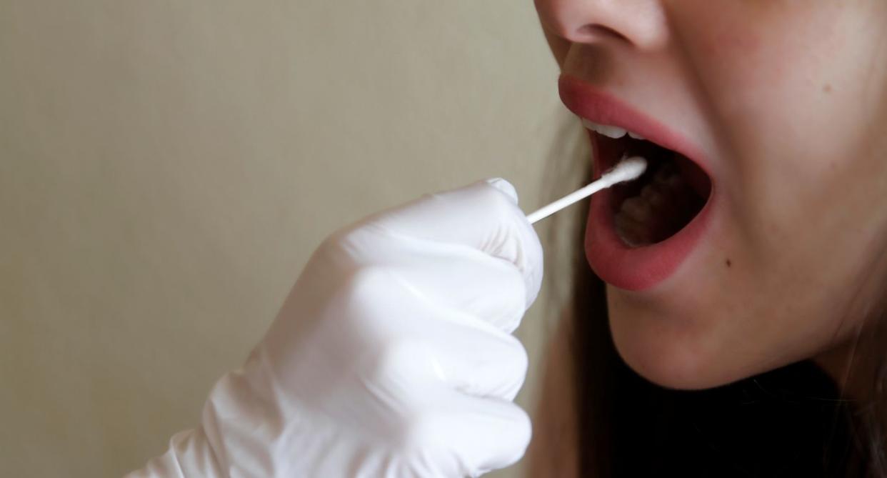 Woman getting mouth swap, to represent non-genital STIs. (Getty Images)