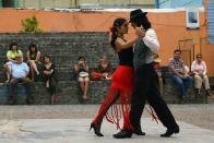 A couple dance to tango music, Tango was born in the suburbs of Buenos Aires.