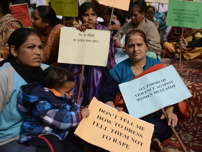 Indian activists hold placards during a protest against the gang rape and murder of a student in New Delhi on January 15, 2013