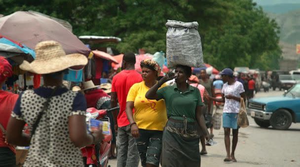 PHOTO: Women walk in Gonaives market. (Bernabe Leobardo Salinas Jasso/ABC News)