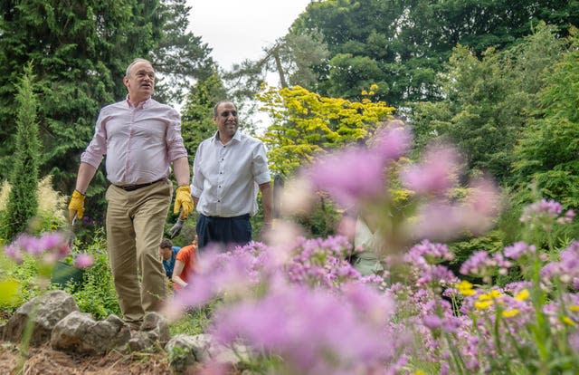 Liberal Democrats leader Sir Ed Davey with an insect hotel during a visit to gardens in Sheffield