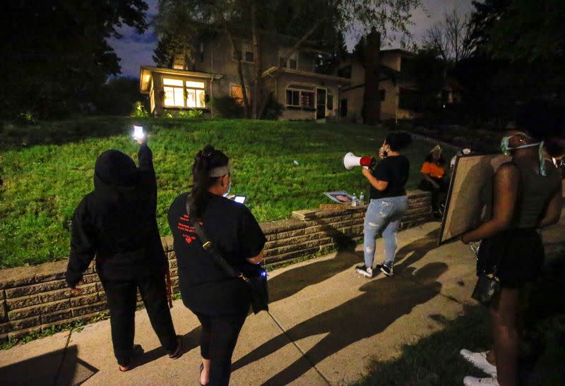 Protesters gather outside the home of Hennepin County Attorney Mike Freeman in Minneapolis