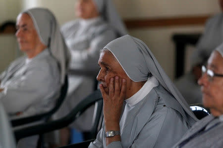 Nuns of Misioneras de la Madre Laura watch on television (not pictured) as Pope Francis celebrates holy mass in Bogota, in Medellin, Colombia September 7, 2017. REUTERS/Fredy Builes